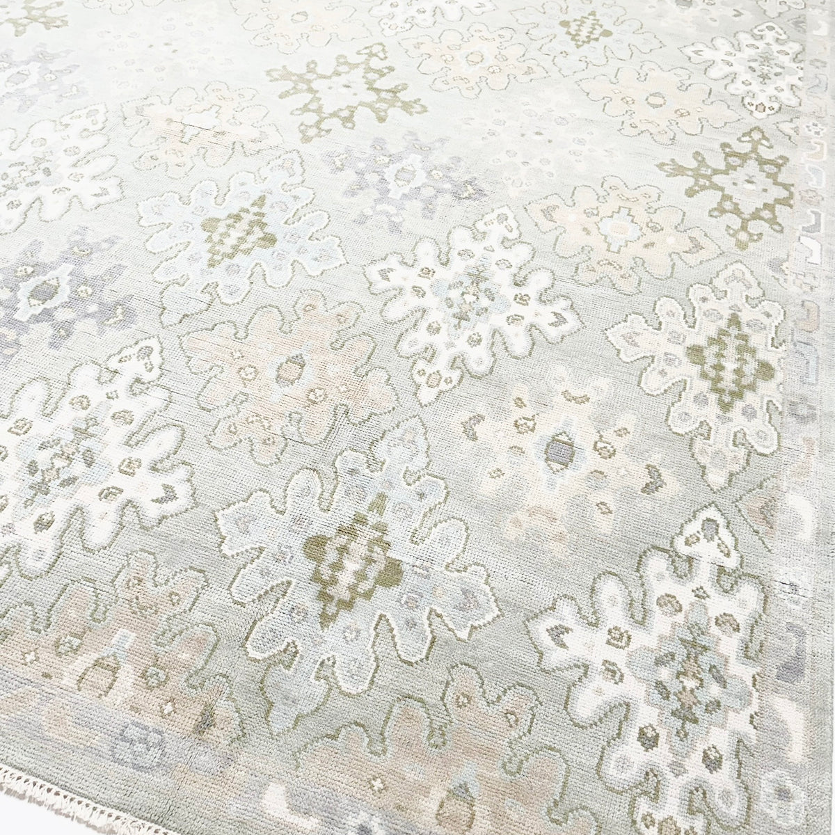 Bright blue and green modern oushak rug.