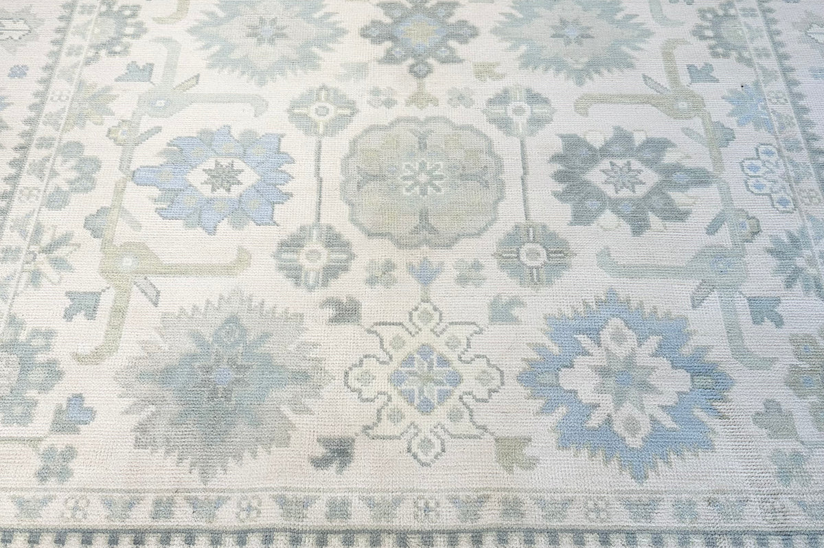 Patterned rug with geometric design in neutral colors